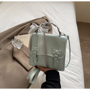 Detailed mint green PU leather bag with lace bow and silk scarf wrapped handle decoration