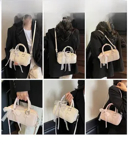 Detail shots of beige boston bag with lace bows shown in hand and crossbody styles
