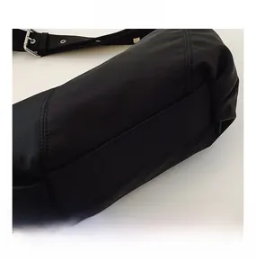 Close-up of black pleated dumpling bag showing high-quality durable nylon fabric texture