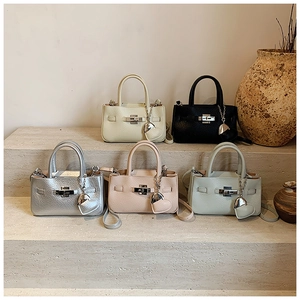 Litchi pattern crossbody mini bags with heart charms shown in five elegant colors