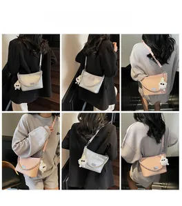 Detail shots of French style quilted shoulder bag with chain strap and plush charm pendant