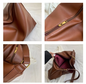 Detailed views of brown leather tote bag showing gold zippers and red fabric lining