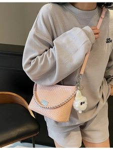 Women French Niche Woven PU Leather Underarm Bag Fashion Versatile Shoulder Crossbody Bag With Metal Chain And Plush Charm