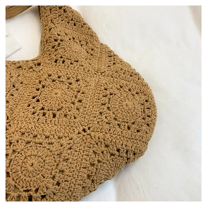 Close-up of khaki crochet tote bag featuring handcrafted hollow flower weave texture