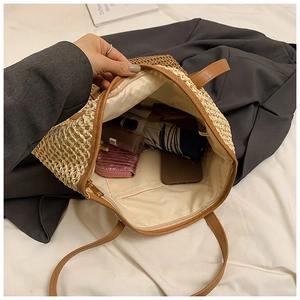 Straw tote bag interior view showing large capacity for cosmetics and essentials