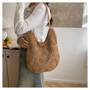 Close-up of the beige crochet floral pattern and texture on this handmade tote bag