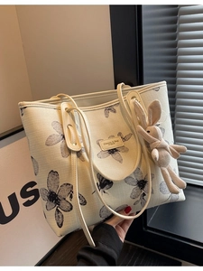 Grand sac cabas en toile beige avec imprimé floral et charmant lapin en peluche
