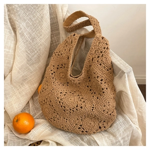 Detailed macro view of handmade crochet tote bag with sunflower hollow knit pattern