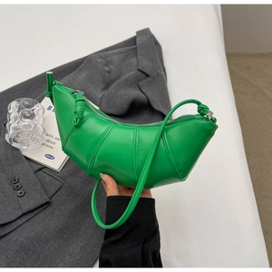 Detail of green crescent bag with stitched PU leather and adjustable knotted strap