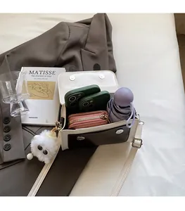 Interior view showing the large storage capacity of this stylish contrast crossbody bag