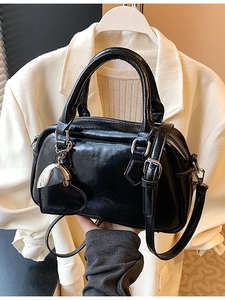 Glossy black patent leather bowling bag with heart charm and silver hardware accents