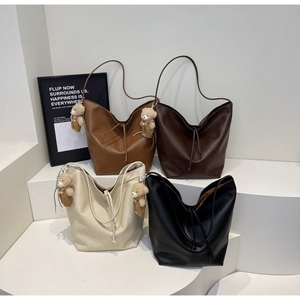 Collection of minimalist faux leather tote bags in four colors with bear charms