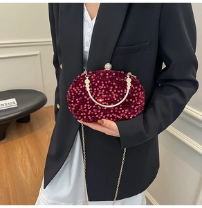 Elegant burgundy sequined evening clutch bag with gold chain strap for banquets.