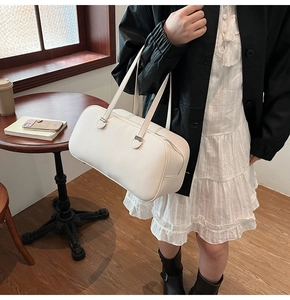 Close-up of white lychee pattern leather texture on a minimalist large tote bag