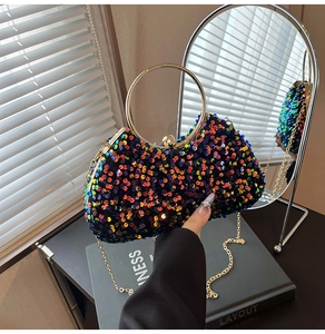 Macro view of colorful sequin evening bag with gold circular handle and chain