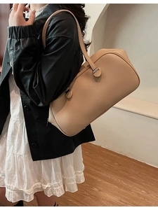 Minimalist beige lychee grain Boston bag with silver hardware for daily commute