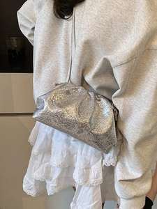 Silver metallic cloud bag with pleated lizard pattern and slim crossbody strap