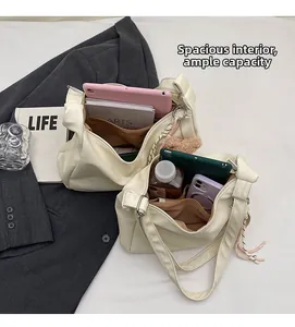 Detail view of the spacious inner compartment of the soft PU leather tote bag