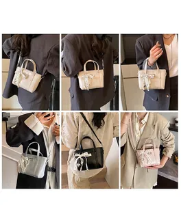 Mini PU-Handtasche mit Spitzenschleifen und Perlenanhängern in mehreren Farben gezeigt