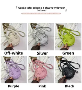 Mini round crossbody bags in six colors including silver and pink with litchi texture