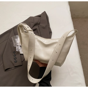 Minimalist soft PU leather hobo bag in cream white with adjustable wide shoulder strap