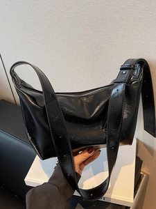Fashionable black glossy pleated hobo bag with adjustable wide shoulder strap for women
