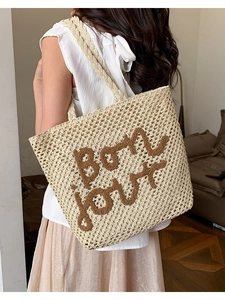 Borsa tote in paglia intrecciata a mano con ricamo Bon Jour in beige e marrone