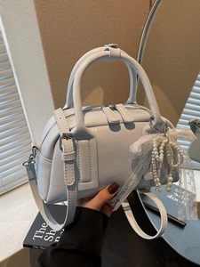 Light blue faux leather Boston bag with pearl tassel and lace bow detail