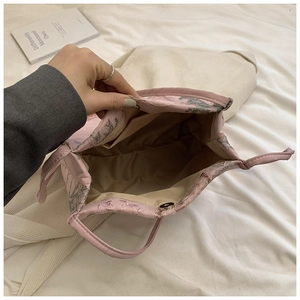 Pink floral canvas bucket bag with magnetic closure and elegant tree pattern print