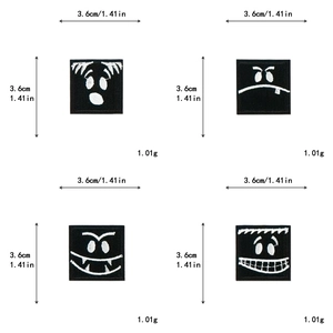 Detail view of 3.6cm square black embroidery patches with white cartoon faces for DIY