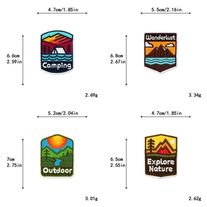 Detail showing outdoor adventure patches with camping, mountain, and forest embroidery