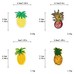 Detailed view of four assorted pineapple embroidery patches with precise measurements