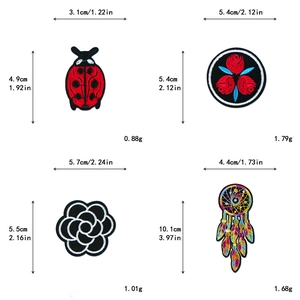 Detailed view of embroidered patches featuring ladybug and rose designs with size markers