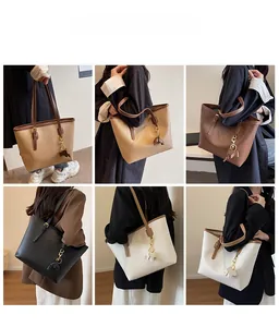 Detail view of large tote bags in four colors with elephant pendant and adjustable straps