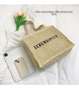 Top view of beige straw tote bag with Serendipity text and size comparison with iPad