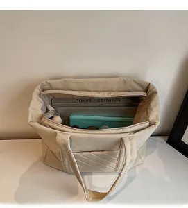 Top view of spacious canvas tote bag interior showing large capacity with compartments