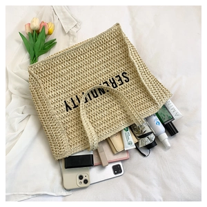 Spacious beige woven tote bag with SERENDIPITY print showing large storage capacity