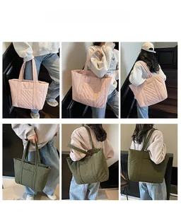 Detailed quilted texture of large capacity tote bag in pink and olive green variants