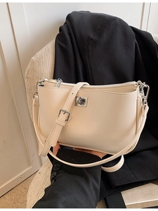 Elegant cream white leather underarm bag with a stylish silver square metal lock buckle