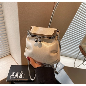Detail of cream pleated leather mini crossbody bag with silver kiss-lock frame and chain