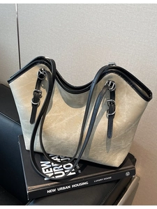 Retro large beige tote bag with black trim and WWTU logo detail for daily commuting