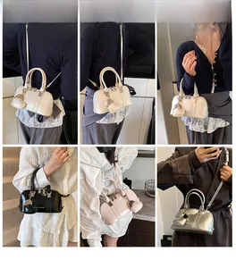 Fashionable shiny patent leather crossbody bags with heart charms in four trendy colors