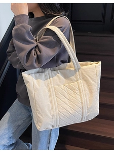 Quilted off-white oversized tote bag for women showing spacious daily commute design
