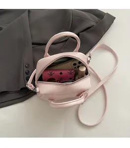 Interior view showing the large capacity of the pink oil wax leather crossbody bag