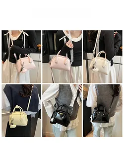 Detail shots of glossy leather bowling bag with heart charm in four soft colors