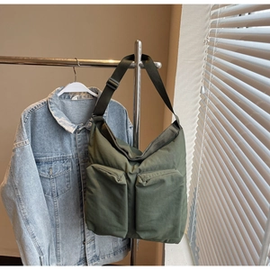 Army green tote bag with large double pockets and wide adjustable shoulder strap