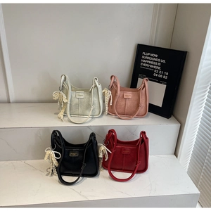 Fashionable half-moon shoulder bags in silver, pink, black, and red with pearl lace bows