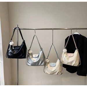 Minimalist half-moon underarm bags in four colors with cute white plush ball charms