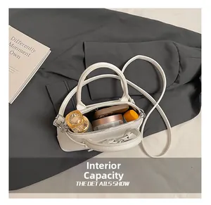 Internal capacity of white lychee leather bag showing makeup storage space