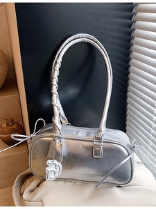 Silver metallic baguette bag with vintage wrinkle texture and white D letter pendant charm